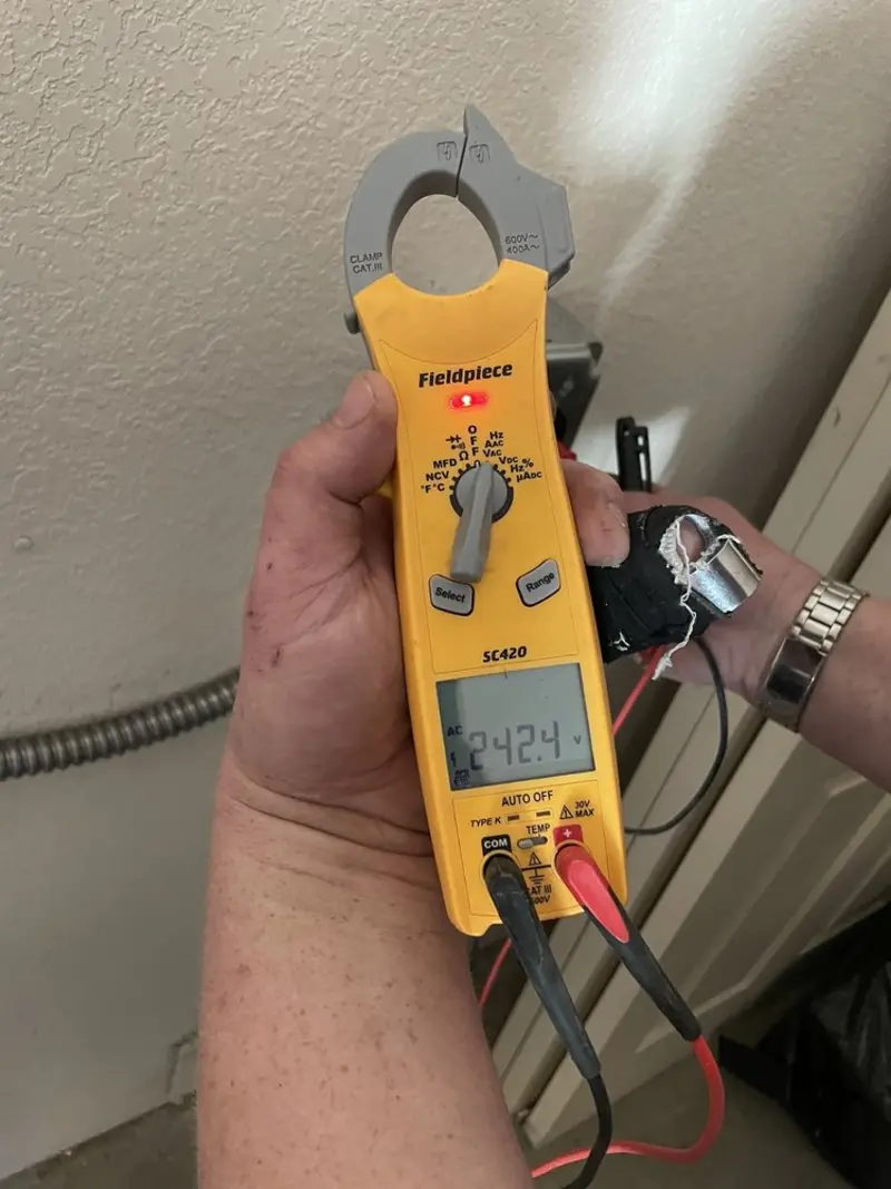Voltage testing with clamp meter during Electrical Installation Services in Tybee Island